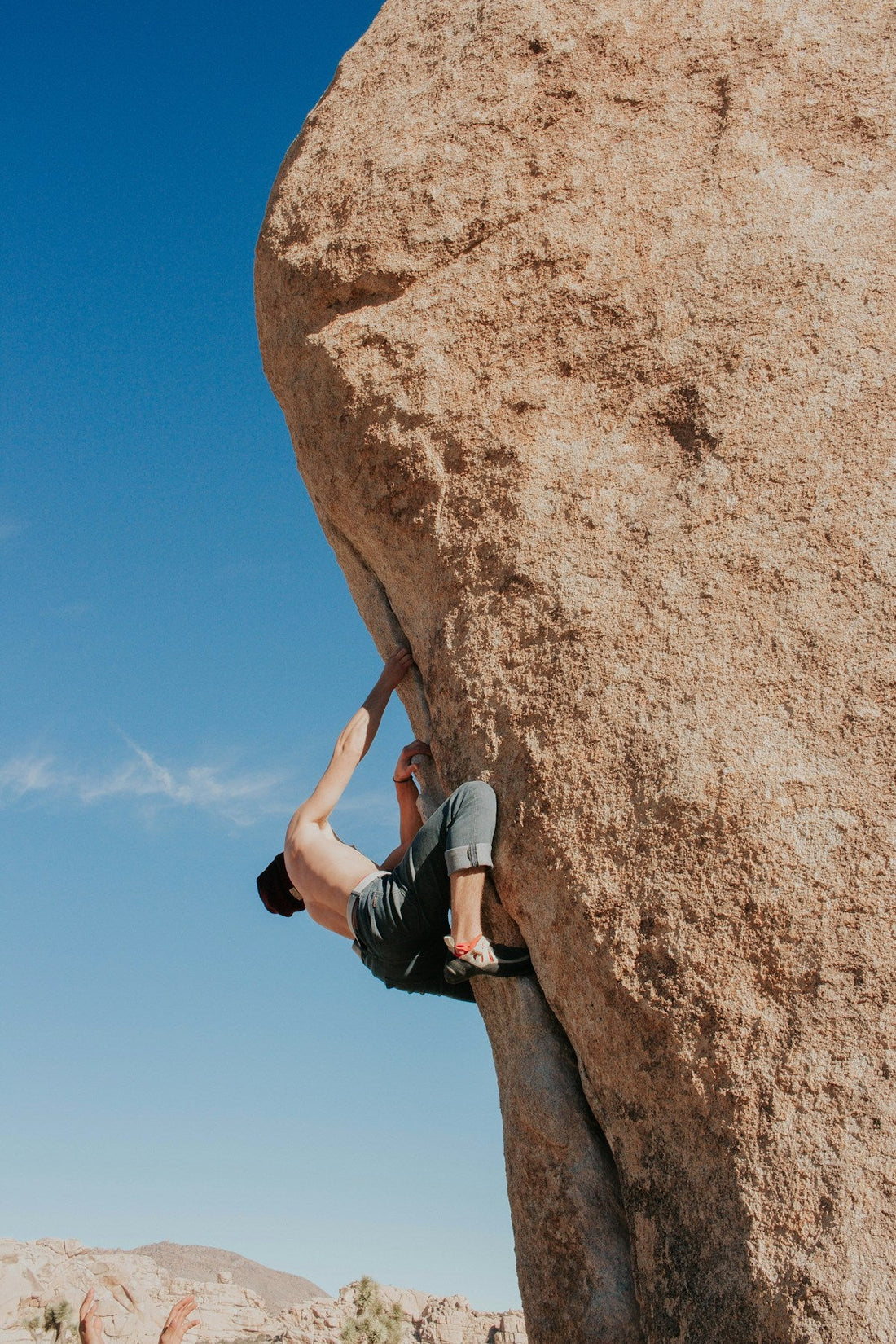 Boulderer topping out on real rock — first outdoor bouldering session