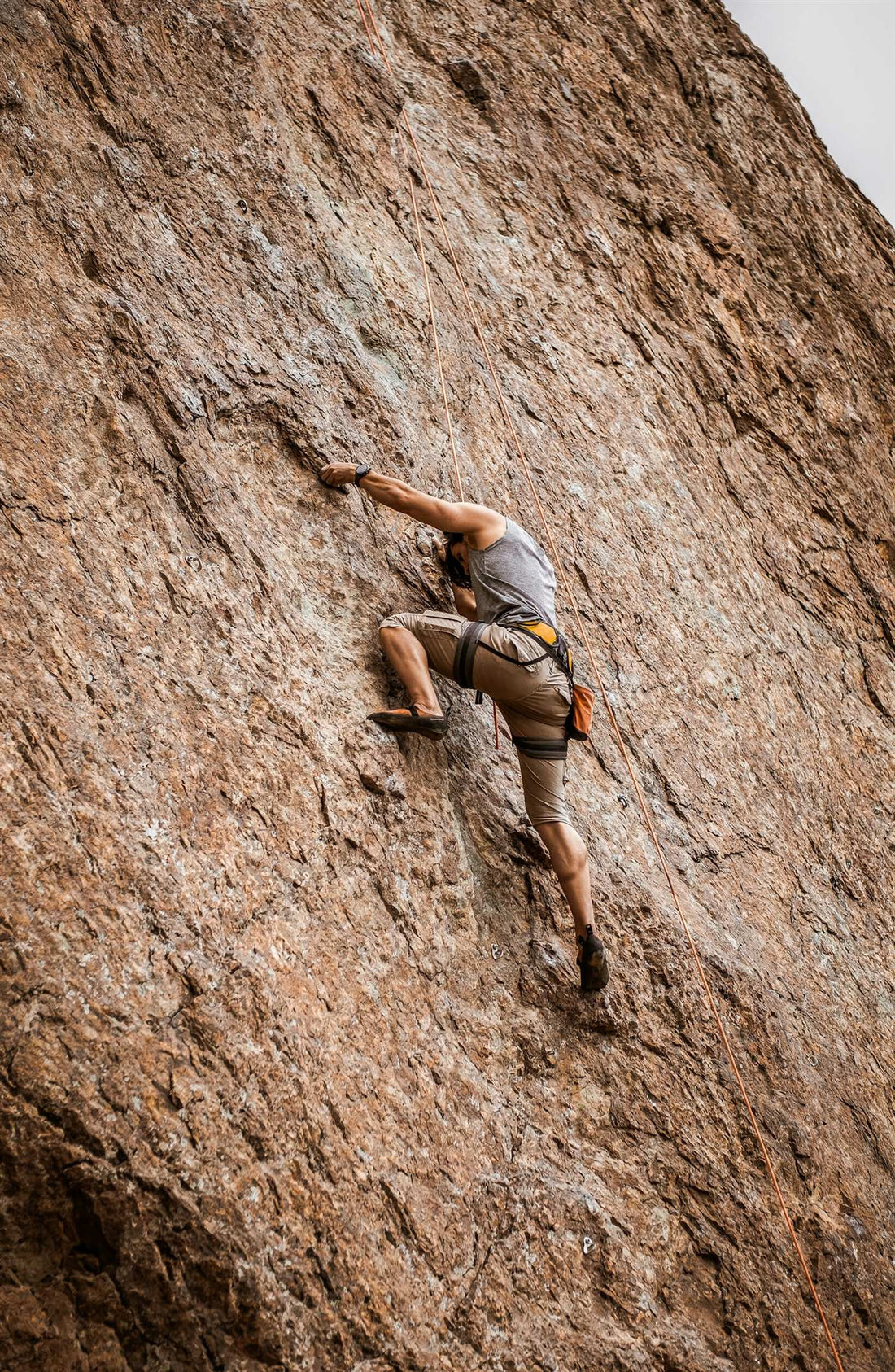 Climber alone on a granite wall — the CRACX origin story