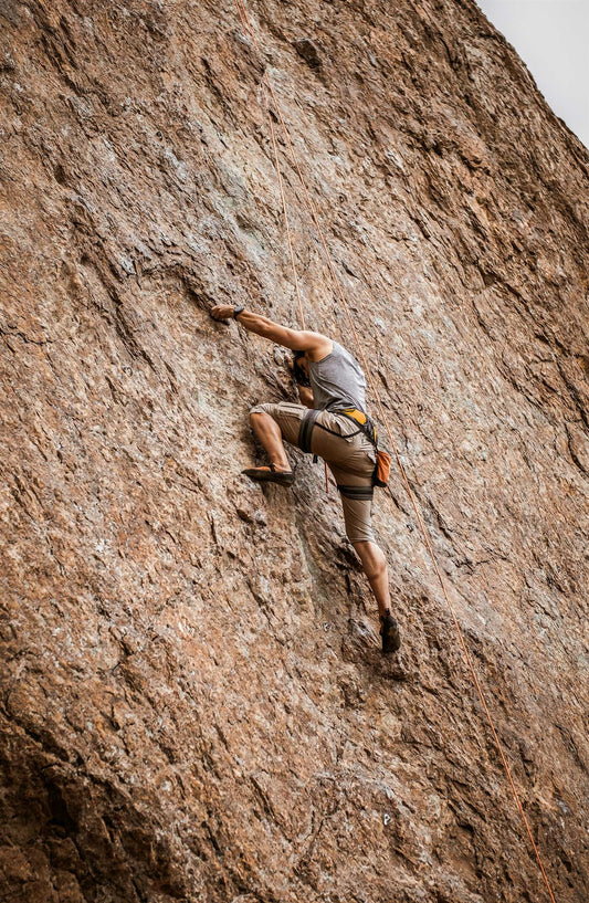 Climber alone on a granite wall — the CRACX origin story