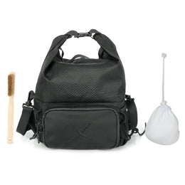 CRACX Ascend chalk bucket shown with the bamboo climbing brush and refillable chalk ball that ship inside it
