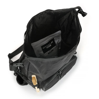 Inside the CRACX Ascend chalk bucket from above, chalk ball pouch in the main compartment and a brush held in the side elastic loops