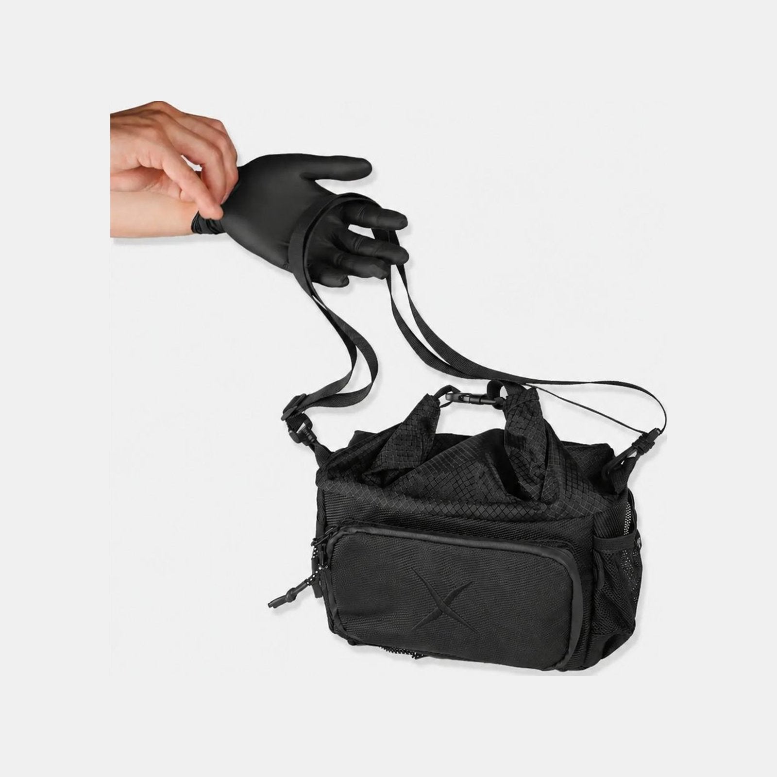 CRACX Ascend bouldering chalk bucket hanging from its adjustable shoulder strap